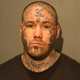 Illustration for article titled Alleged Murderer Has Cardinals And White Sox Logos Among His Face Tats
